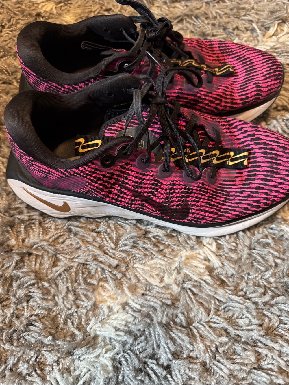 Nike Women's Pink and Black Running Sneakers with Gold Accents